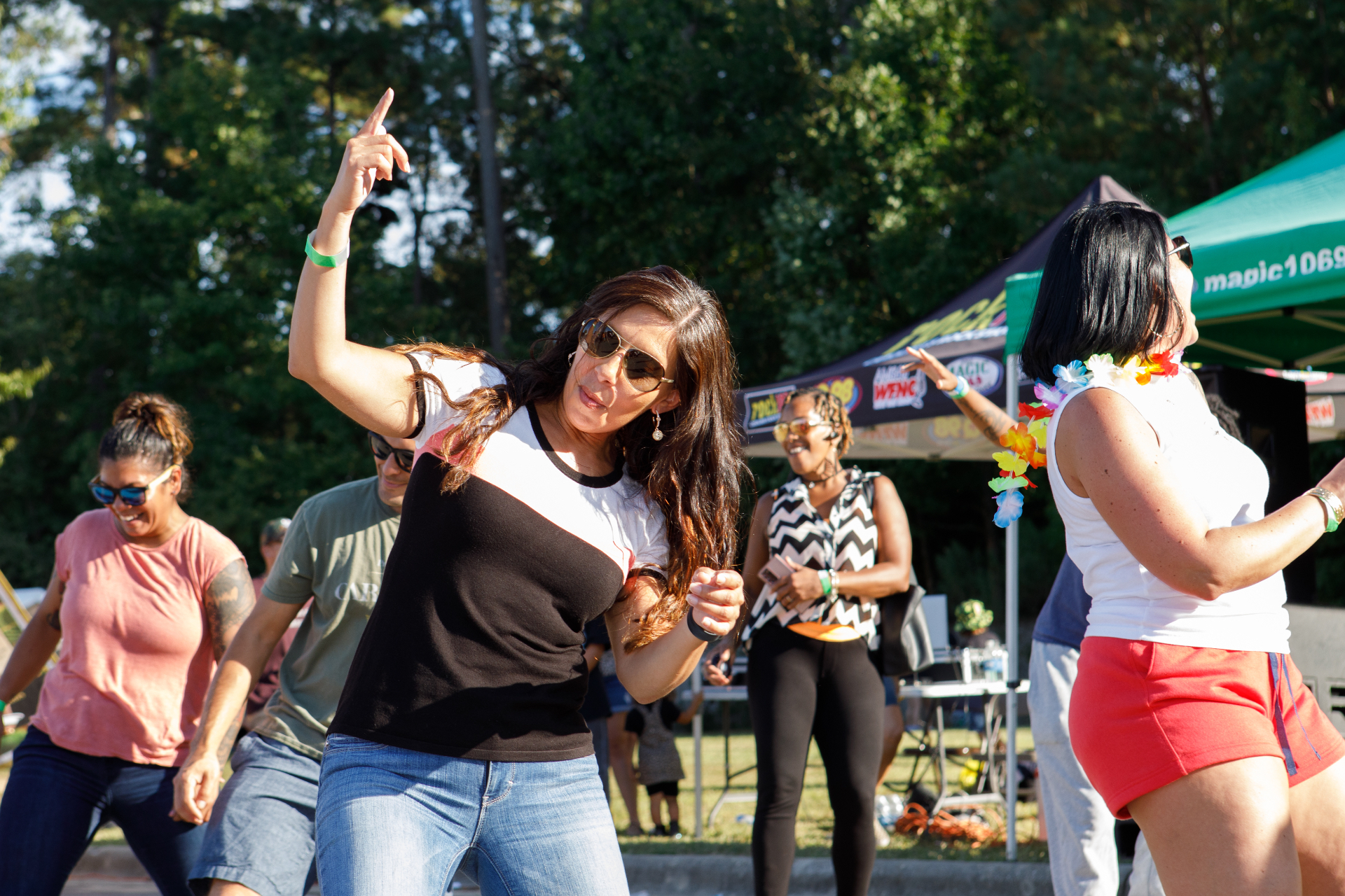 Festival-goers dancing and celebrating at the Taco & Beer Festival